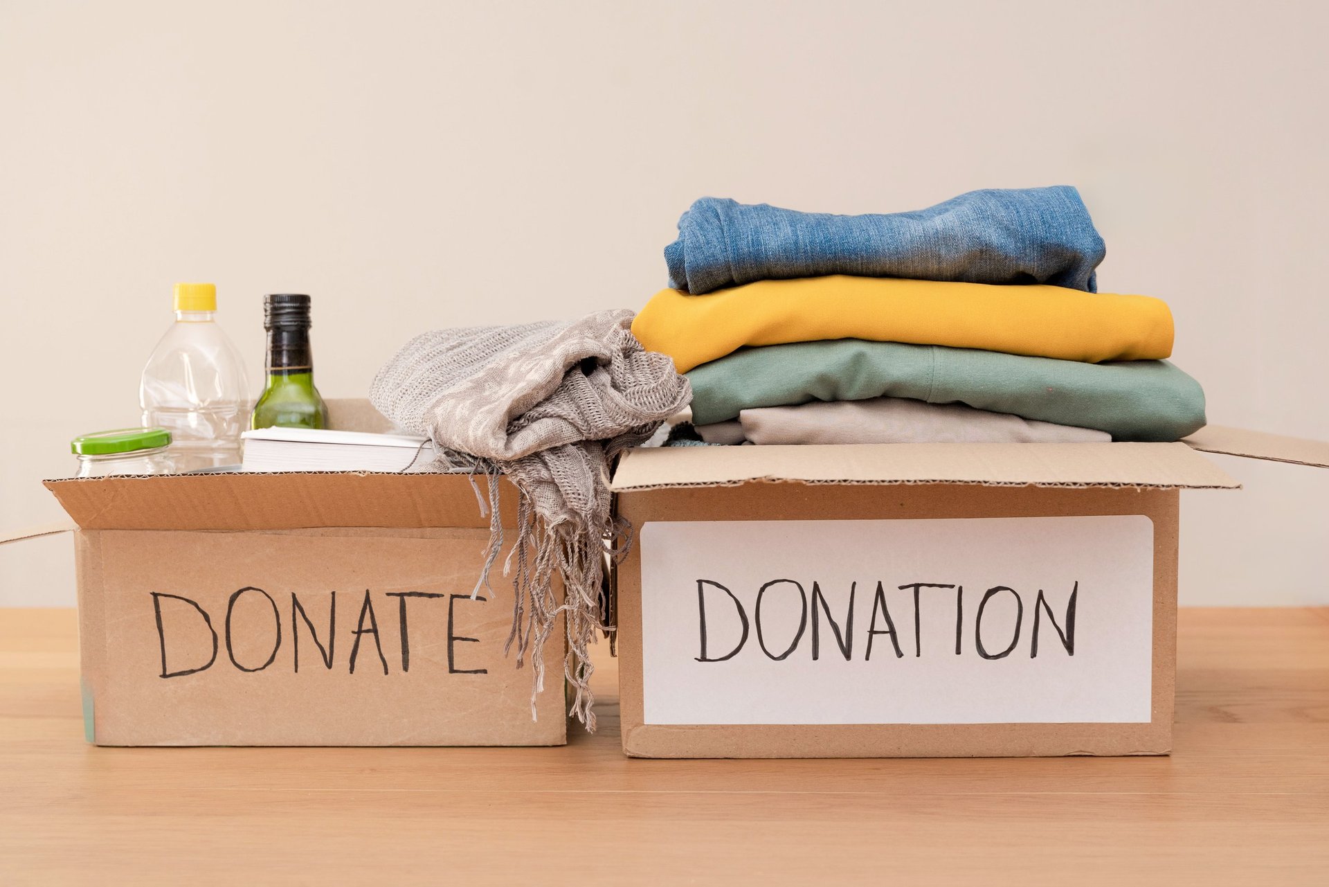 Donation boxes overflowing with various goods